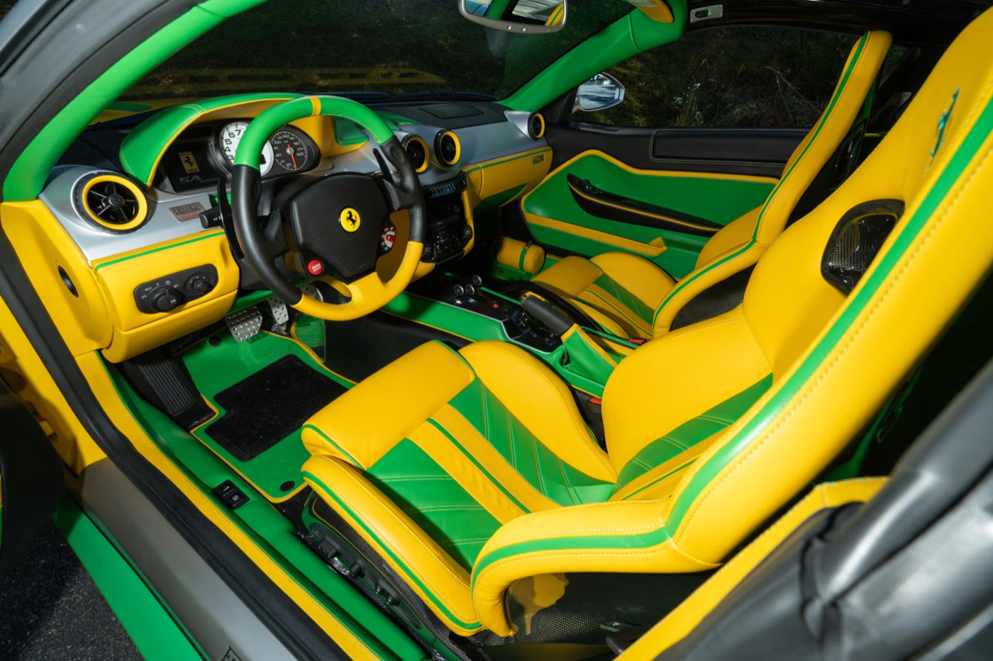 Green-and-yellow leather interior of a Ferrari 599