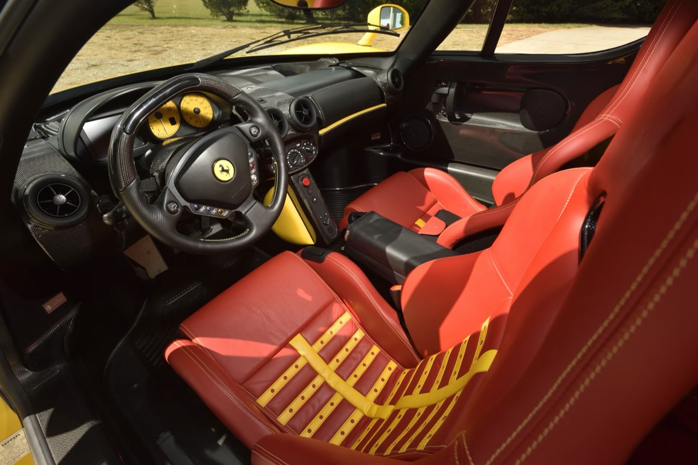Red-and-yellow striped interior of a Ferrari Enzo